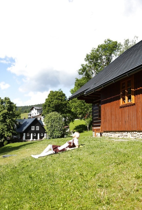 Swiss farm girl Karol Lilien toying pussy on lawn in pigtails