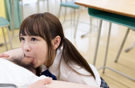 Tiny Asian schoolgirl gets cum on her tongue while sucking her teacher's cock