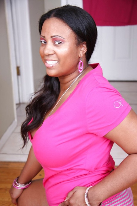 Fatty ebony chick in knee socks undressing and spreading her legs