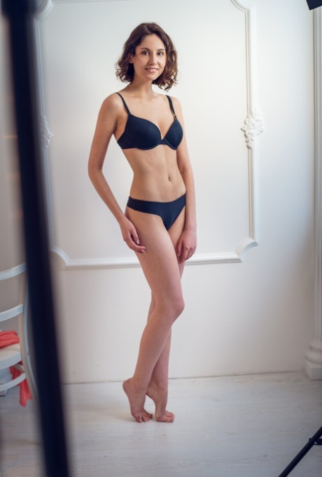 Glasses clad Sade Mare sheds sexy black lingerie to show small natural tits