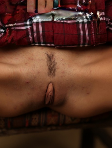 Petite girl Janice Griffith frees her tight slit from upskirt panties