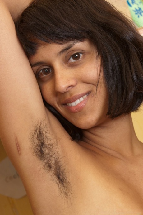 Exotic amateur Sonya N showcases her hairy armpits & masturbates
