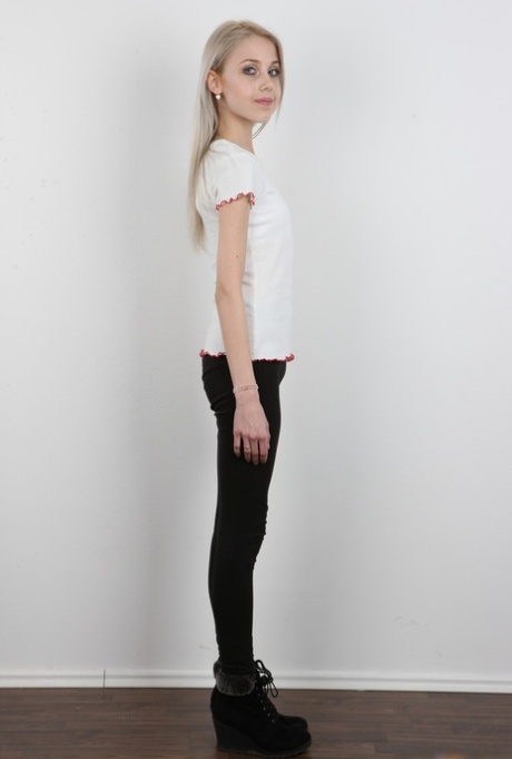 Skinny 18 year old virgin Natalia takes off her clothes to stand in the nude