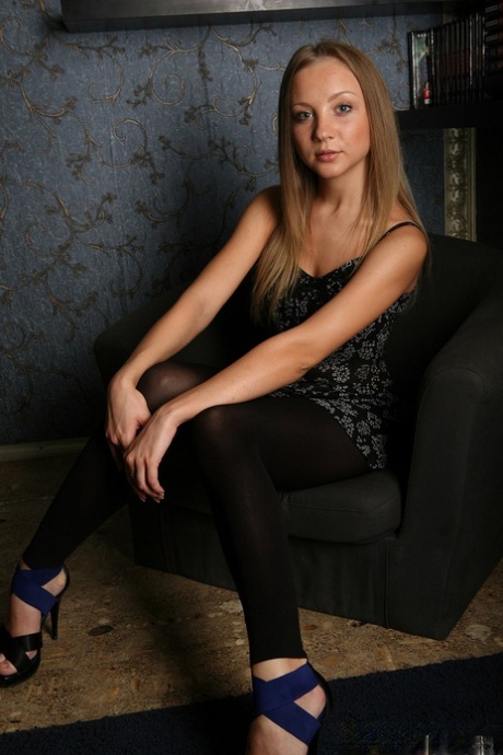 Barely legal blonde removes black leggings on way to modelling in the nude