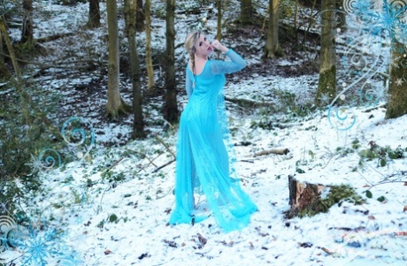 Yuffie Yulan cosplays Elsa from Frozen while displaying her big tits outdoors