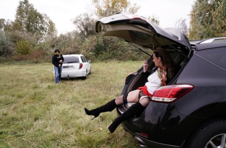 Horny granny Eva Jayne gets cum on her face after a gangbang in a field