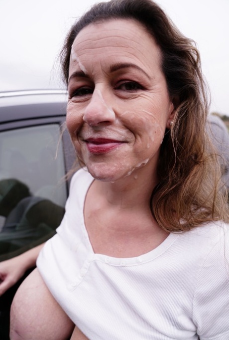 Horny granny Eva Jayne gets cum on her face after a gangbang in a field