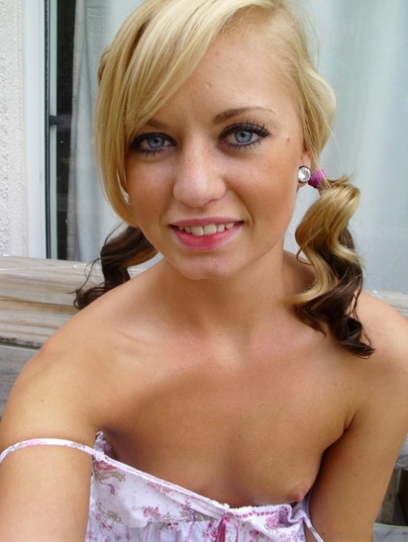 Pretty blonde Tiny Tiff shows her teensy tits & flashes a naked upskirt