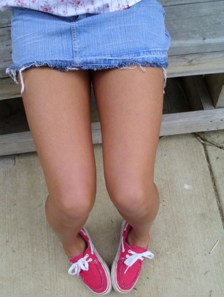 Pretty blonde Tiny Tiff shows her teensy tits & flashes a naked upskirt