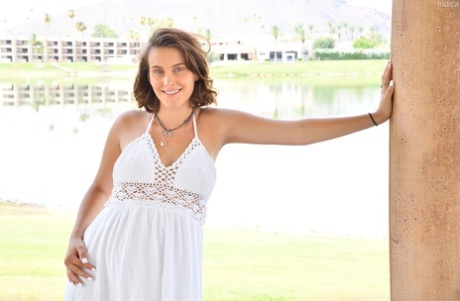 Pregnant amateur Indica squeezes milk from her swollen breasts