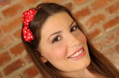 Smiley teenage amateur Zena Little getting naked and fingering her pussy