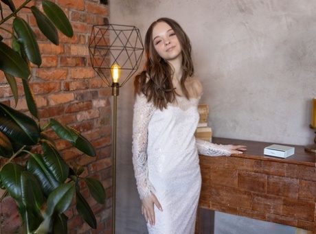 Young beauty highlights her tight ass and tight slit after going nude