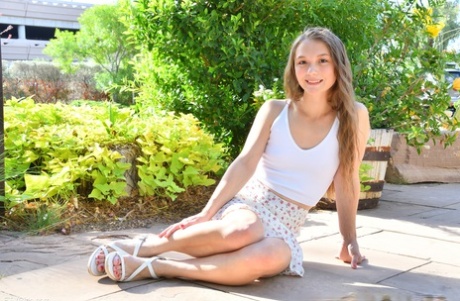 Amateur babe Mira unveils her hot pussy and pierced nips outdoors