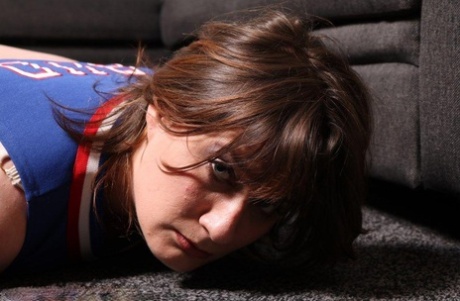 Overweight girl is left alone while tied up and gagged in a cheerleader outfit