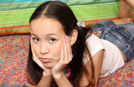 Asian nubile teen Amai Liu spreads legs and plays with her tiny pussy