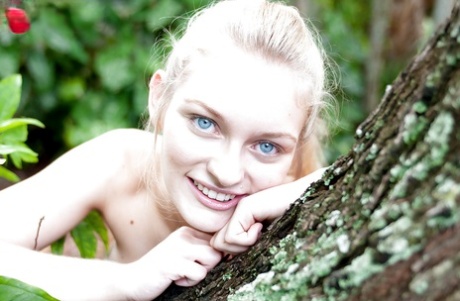 Young blonde girl Alli Rae fingering asshole in the woods in knee socks