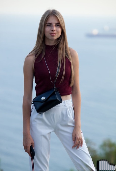 18-year-old Mistri exposes her nice ass getting totally naked near the water