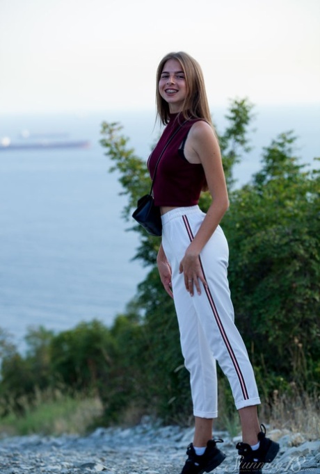 18-year-old Mistri exposes her nice ass getting totally naked near the water