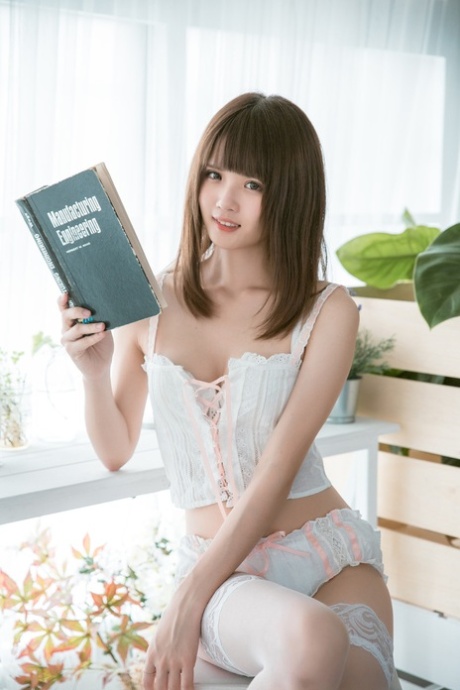 Barely legal Asian teen flaunting her gorgeous body in her cute lingerie