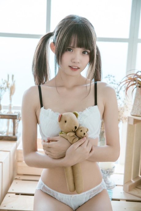 Barely legal Asian teen flaunting her gorgeous body in her cute lingerie