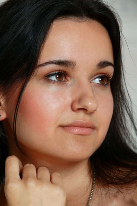 Slender Emily loses her lacy bra and panties to show her saggy boobs