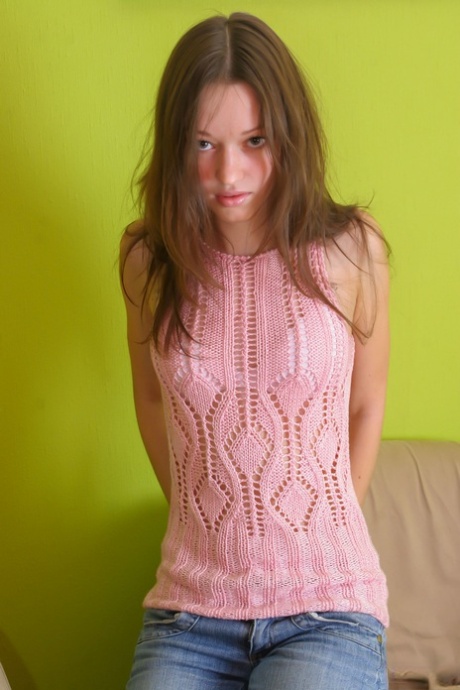 Alluring babe Alexandra C shows off her beautiful breasts while undressing