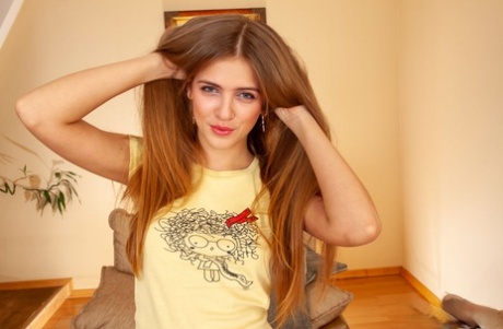 Barely legal teen Hanna A plays with her long hair before showing her ass