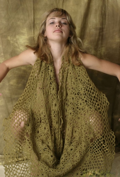 Young blonde Nicole V touts her phat ass during confident nude poses