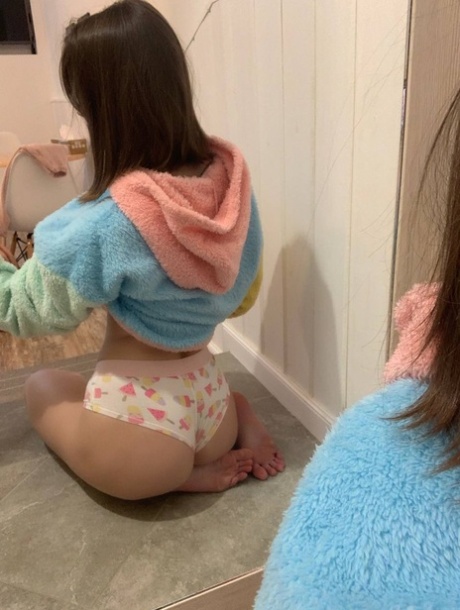 Blue-eyed OnlyFans model Little Kitty shows her perky tits & round ass