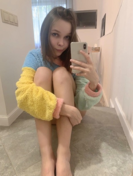 Blue-eyed OnlyFans model Little Kitty shows her perky tits & round ass