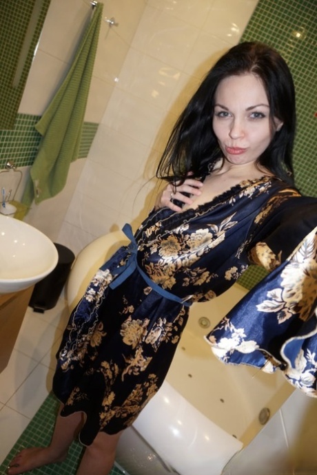 Brunette amateur babe posing naked in her sexy stockings and in tight jeans