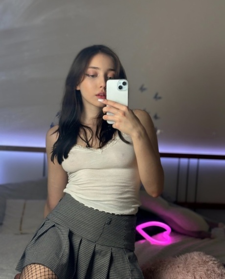 Teen OnlyFans babe Mia Saffron poses in her hot outfits & lingerie in a solo