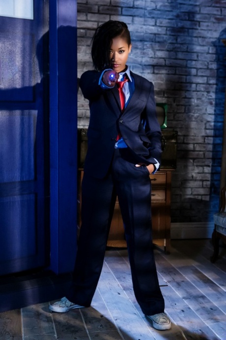 Black dime Skin Diamond strips out of menswear to model in the nude