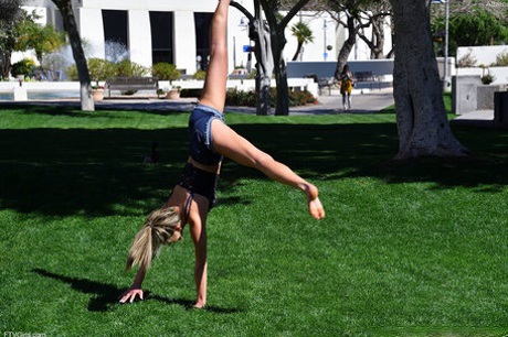 Cute blonde Athena does a cartwheel in shorts during non-nude action in public