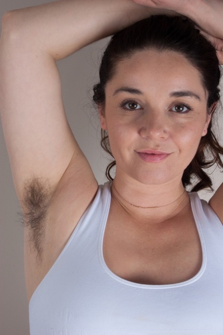 Sports girl Maxine Holloway strips on her mat to reveal her hairy pussy & pits