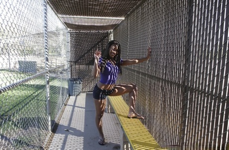 Busty ebony babe in tight shorts flashing outdoor and stripping