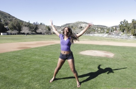 Busty ebony babe in tight shorts flashing outdoor and stripping