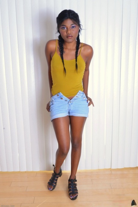 Beautiful ebony teen Yara Skye parts her ass and twat with painted fingernails