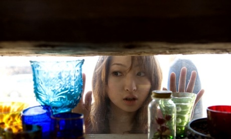 Beautiful Japanese girl Maiko Kazano uncovers her great tits as she gets naked