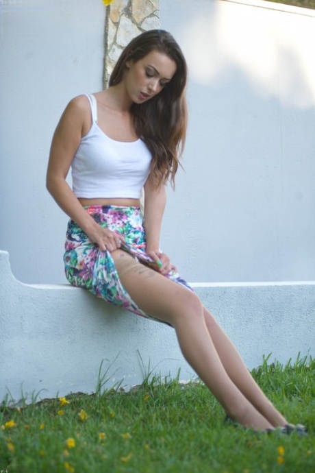 Glamour model Lauren Louise uncups her firm tits in garters and stockings