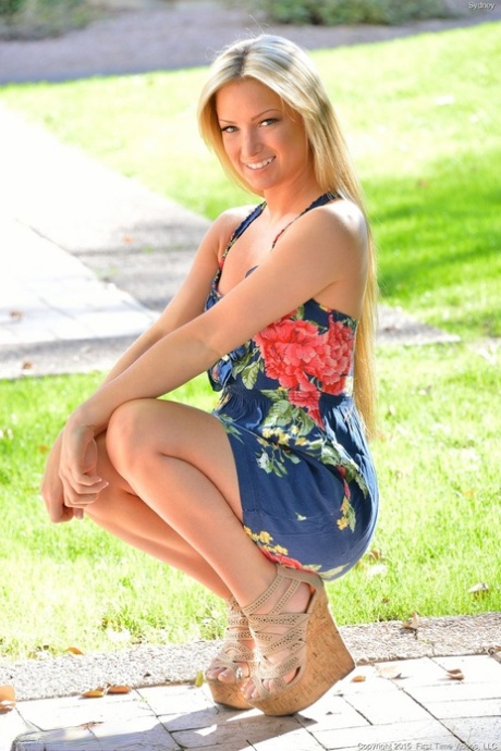 Cute blonde girl flashes no panty upskirt on sidewalk before fun with a banana
