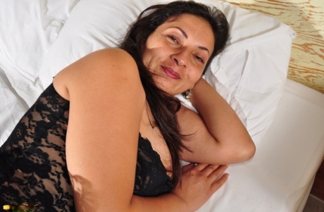 Horny older woman in lace lingerie reveals her big nipples & hairy beaver