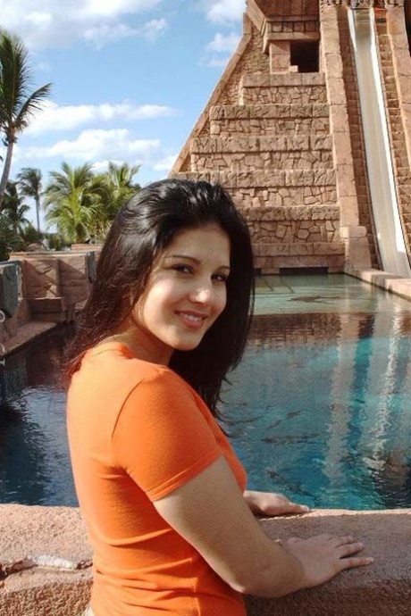 Indian solo girl Sunny Leone bares her tits before sliding shorts over her ass