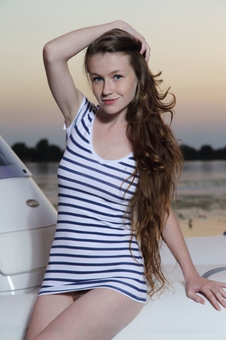 Wild teen Emily Bloom stripping at the lake to expose hairy pussy & nice tits