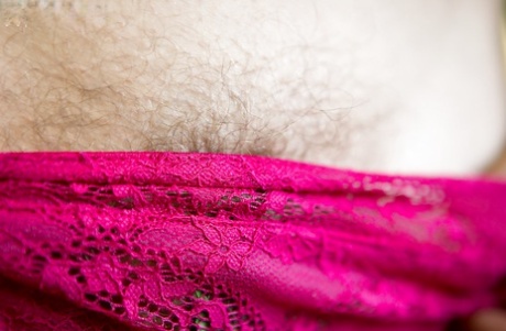 Amateur glasses laden chick Nora spreads her hairy vagina outdoors